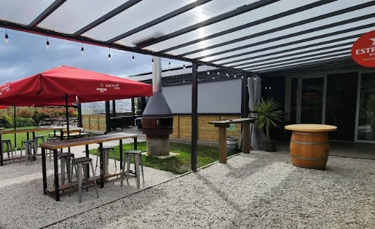 Garden bar seating among the apple trees at Three Wise Birds
