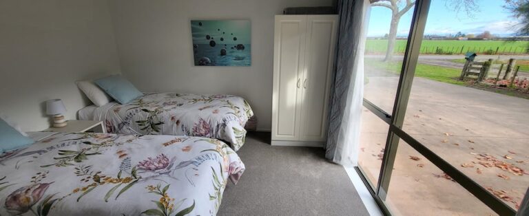 Cottage bedroom 2 with adjustable single beds and desk