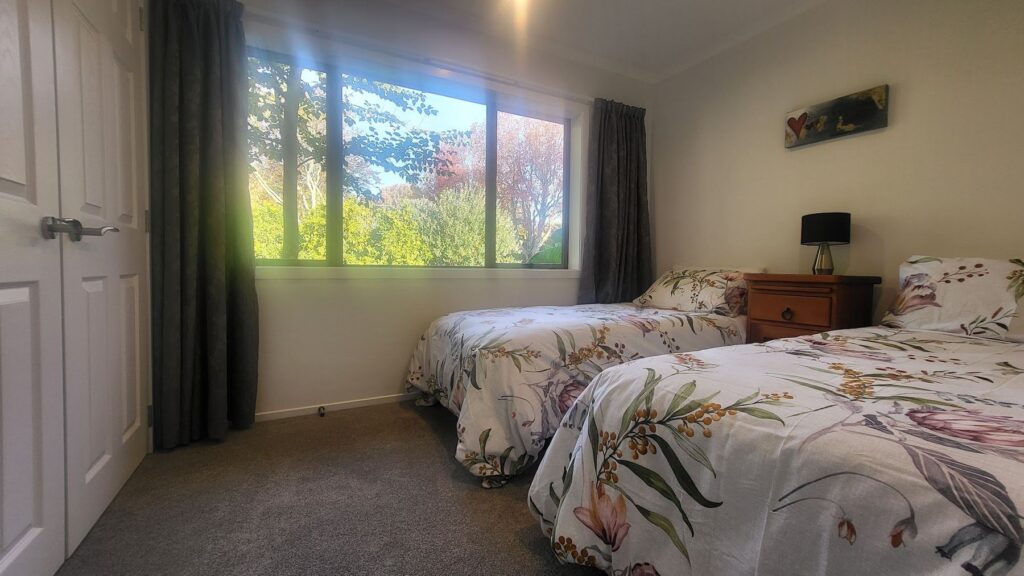 Cottage twin bedroom looking out to the garden