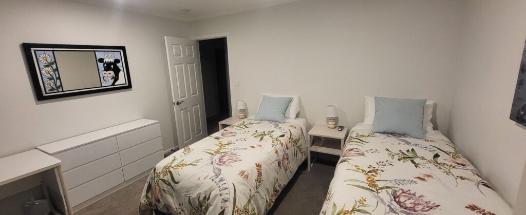 Cottage twin bedroom with floral bedding