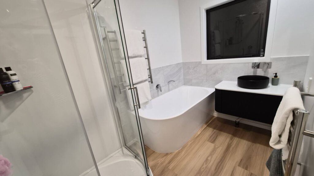 Farmhouse bathroom with freestanding bath and walk-in shower