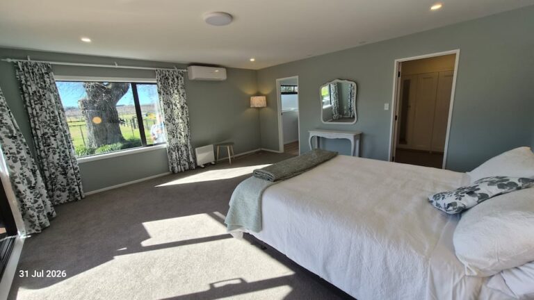 Farmhouse bedroom 1 with queen bed and country views