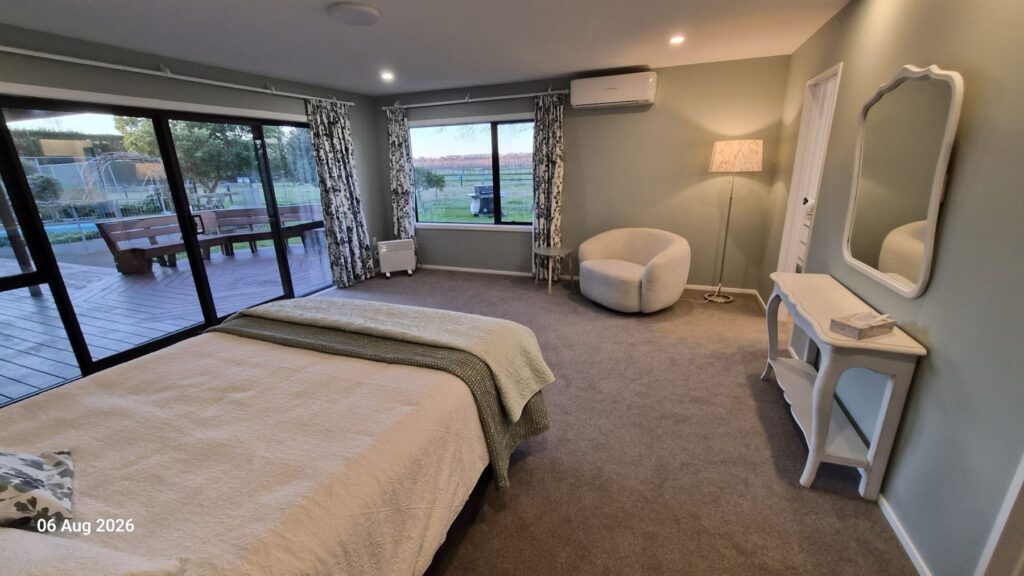 The large main bedroom with paddock views