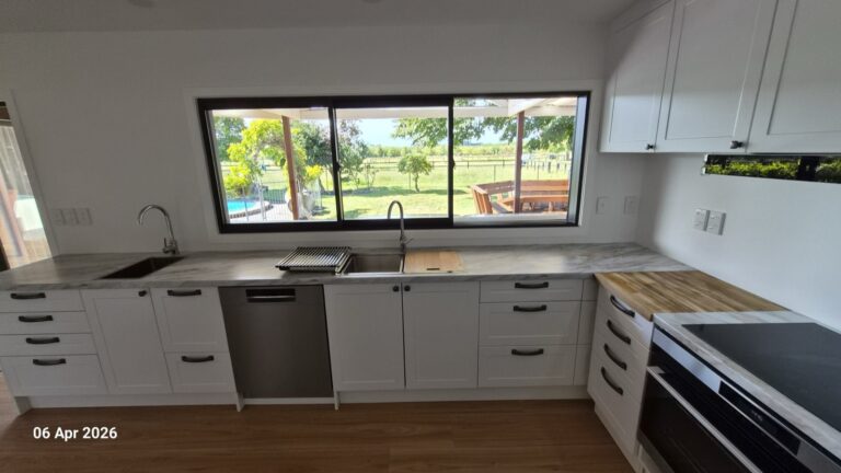 The rebuilt Farmhouse kitchen looking out to the pool and paddocks