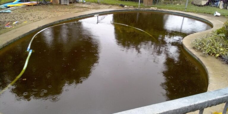 The pool full of silt-laden water after the flood